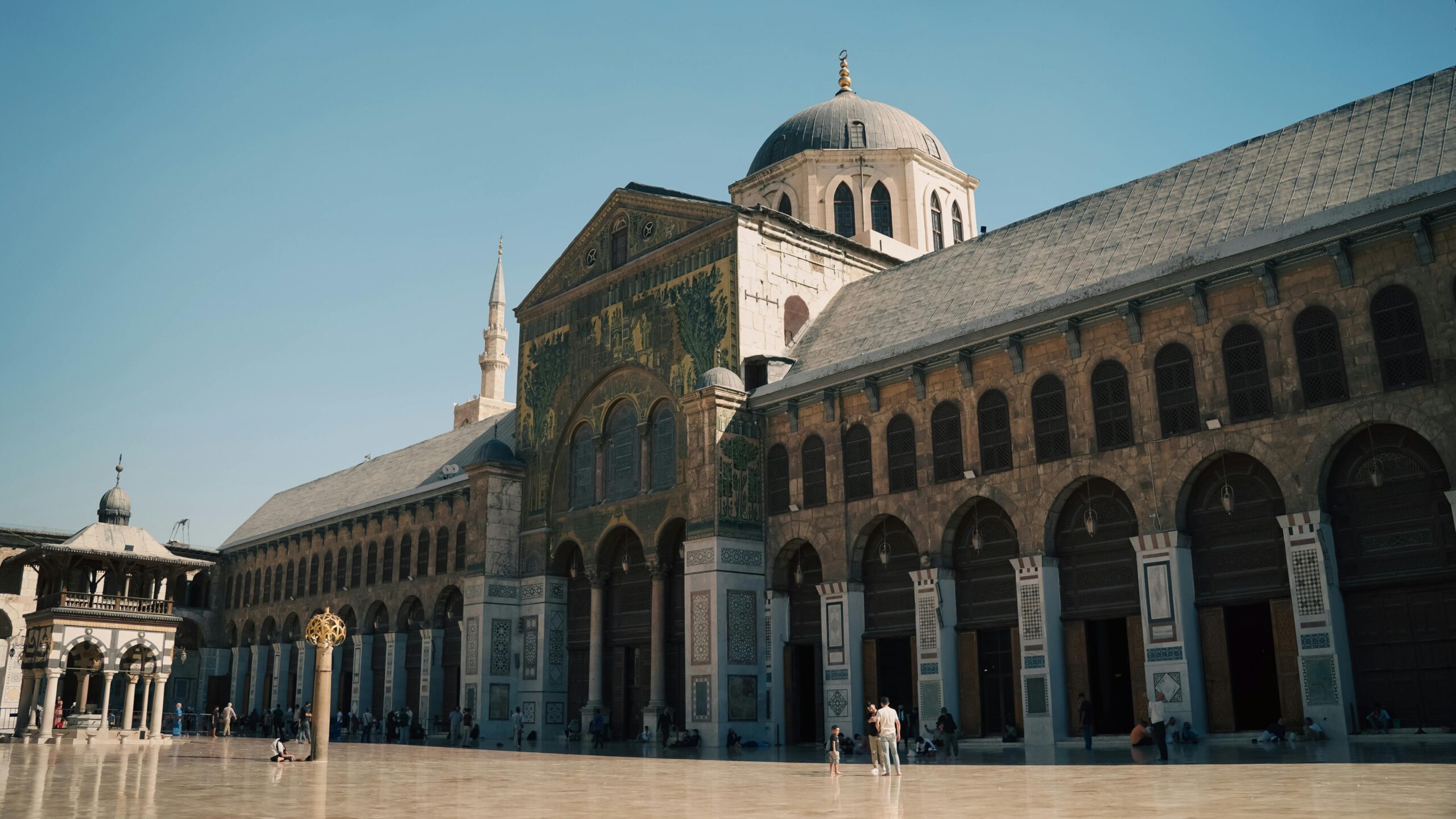 A breathtaking view of the Umayyad Mosque's courtyard in Damascus, showcasing its iconic architecture and cultural significance.